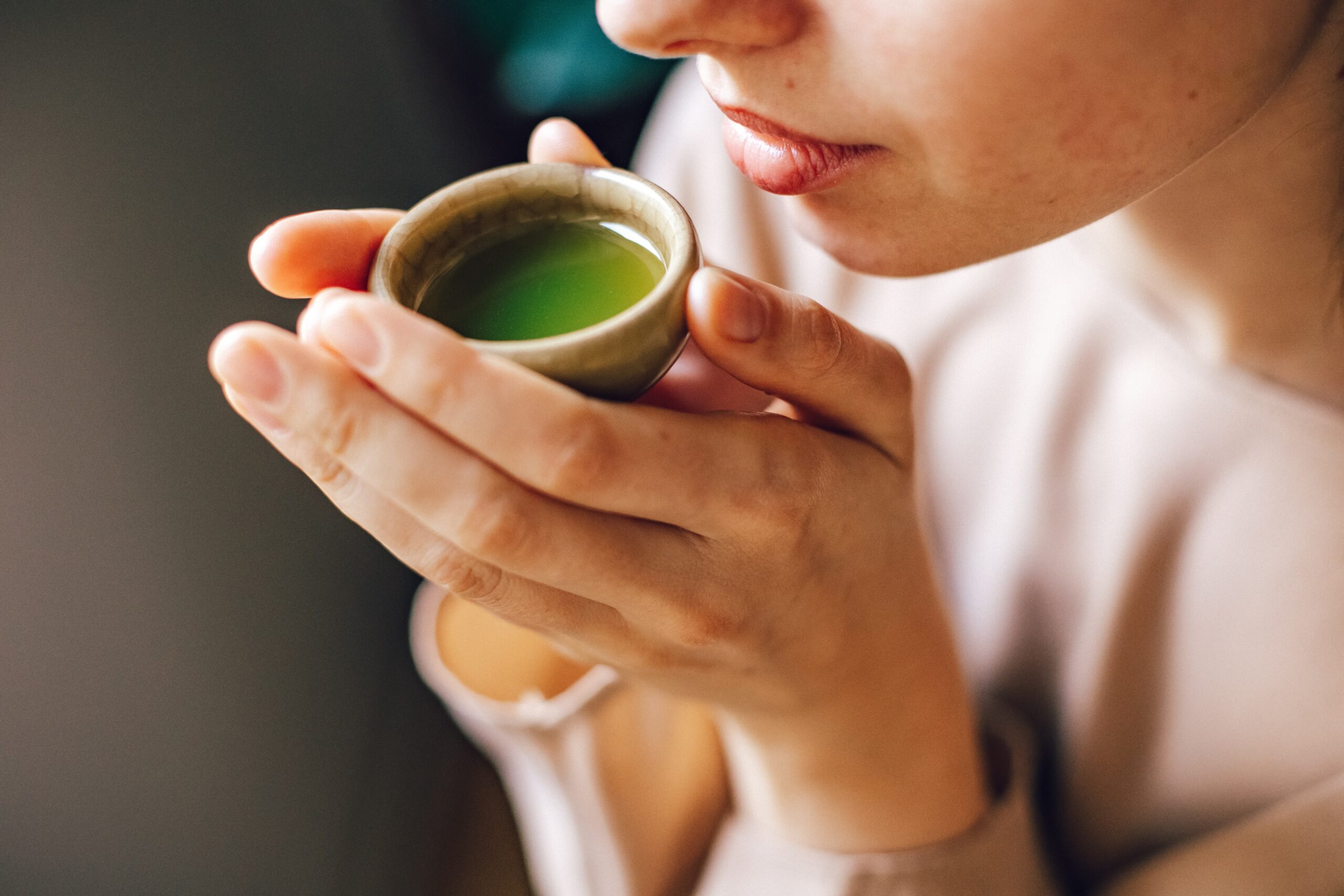 woman drinking matcha tea